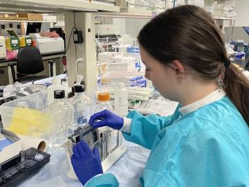 Woman works in science lab.
