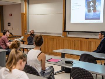 Students and professor in classroom.