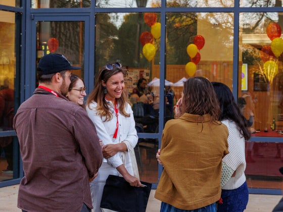 Oberlin students and alumni connect during a networking event, building professional relationships through conversation.
