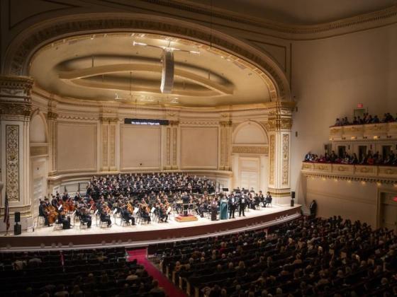 orchestra on stage of Carnegie Hall