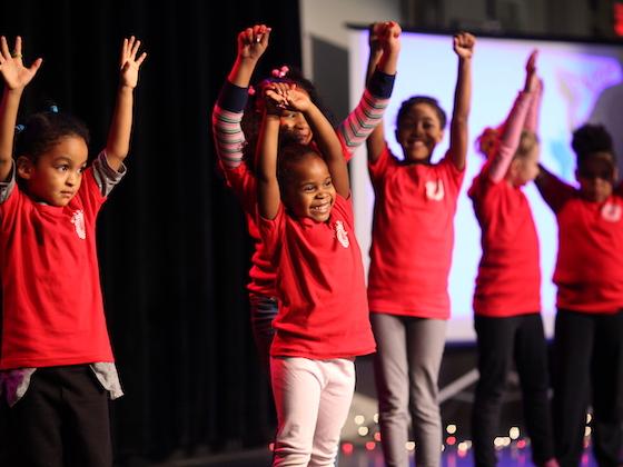 Girls from the Girls in Motion program performing on stage.