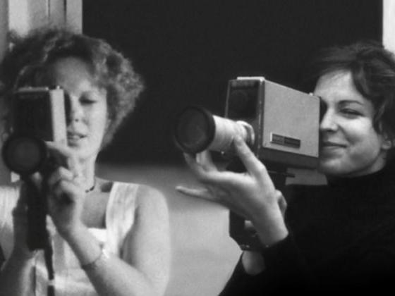 Two women filming. Black and White.