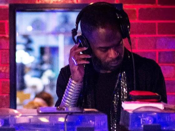 A person in a black shirt deejaying.