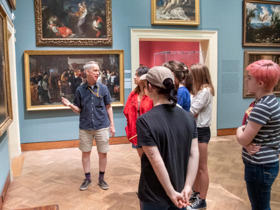 A class meets in a museum gallery.