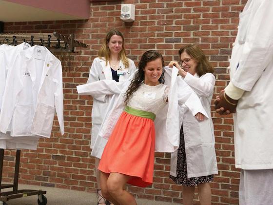 Kate trying on a lab coat.