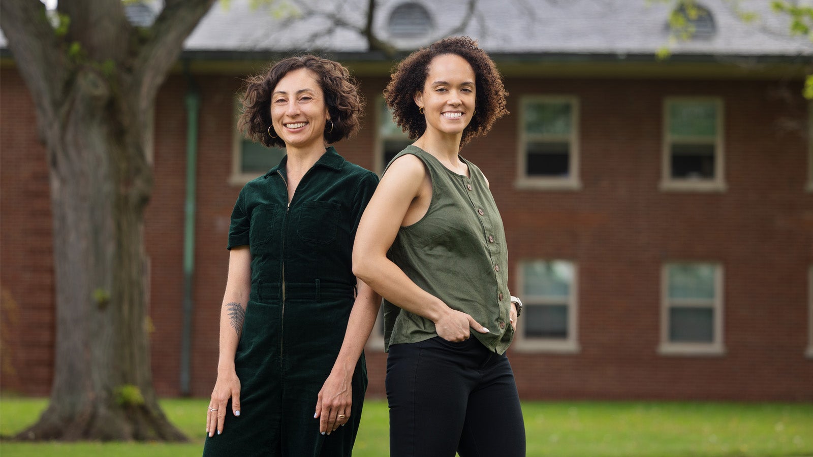 two people stand on Oberlin's campus smiling