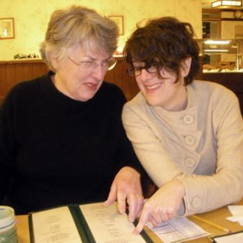 2 women look at a menu