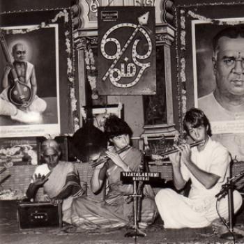 Street musicians in India playing flute