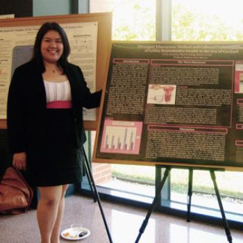 Cindy shows a research poster