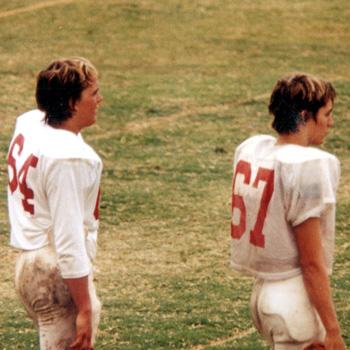 Two football players in the 1980s wearing numbers 64 and 67
