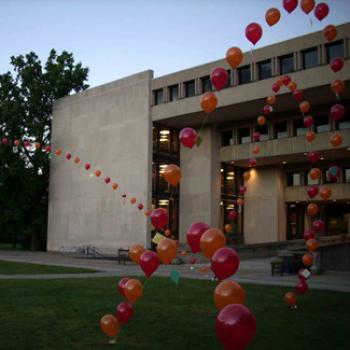Arches of balloons in front of the Mudd building