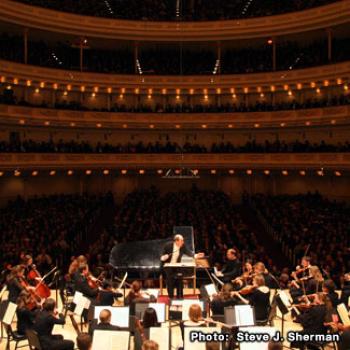 Orchestra on stage at Carnegie Hall