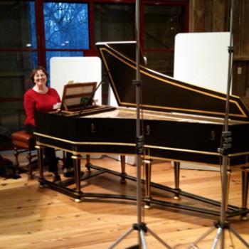 Karen seated at a harpsichord