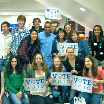 Group of students, several holding signs that say Vote 2010
