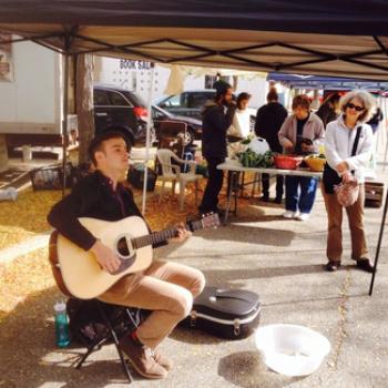 Rob plays acoustic guitar at the Oberlin Farmers' Market.