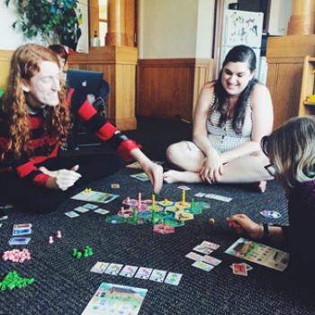 Sammy and friends play a boardgame.
