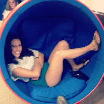 Sarah relaxes in a 'womb chair.'