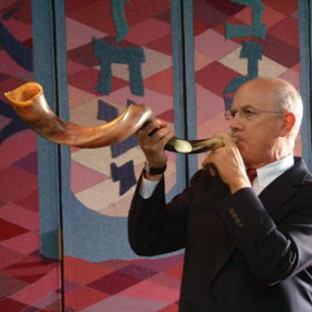 Stewart plays an unusual, curled horn.