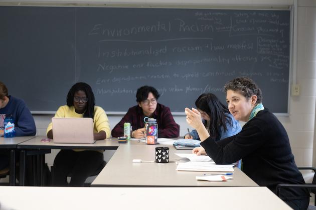 Professor Renee Romano and students in class.