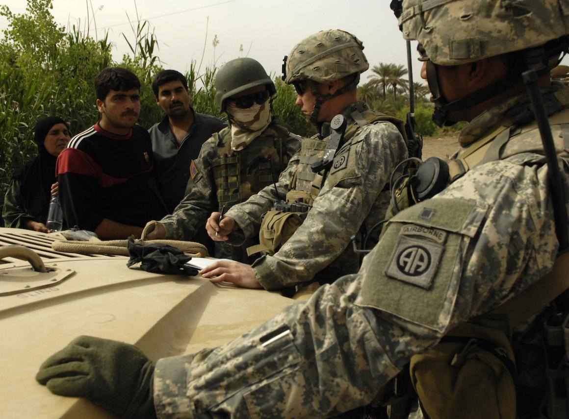 U.S. Army Soldiers conduct tactical questioning of locals during a presence patrol in As Sadah, Iraq, April 7, 2007.