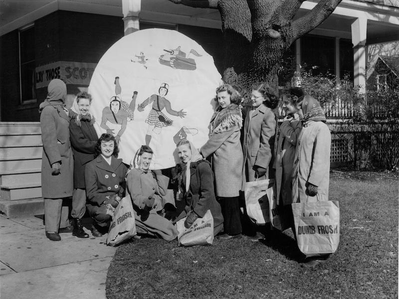 Women standing by decorations at Tank Hall in 1943.