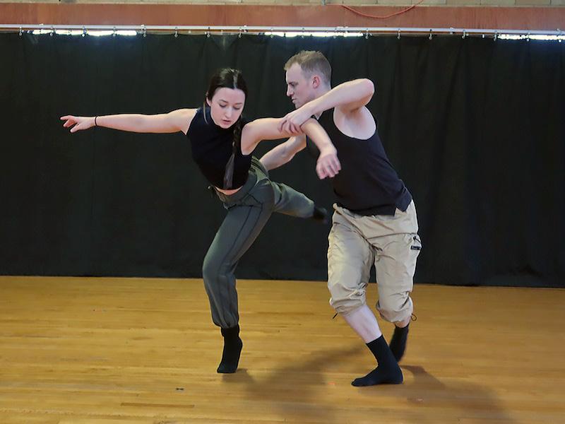 Two dancers rehearse.