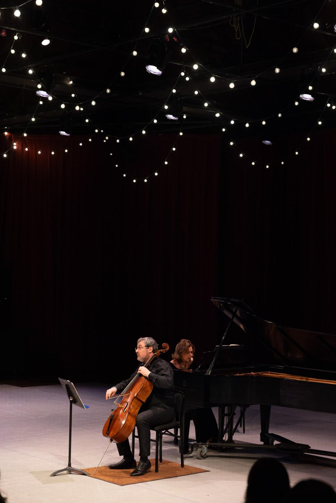 Professor Kouzov performing with pianist Yulia Fedoseeva on stage at Hidden Valley.