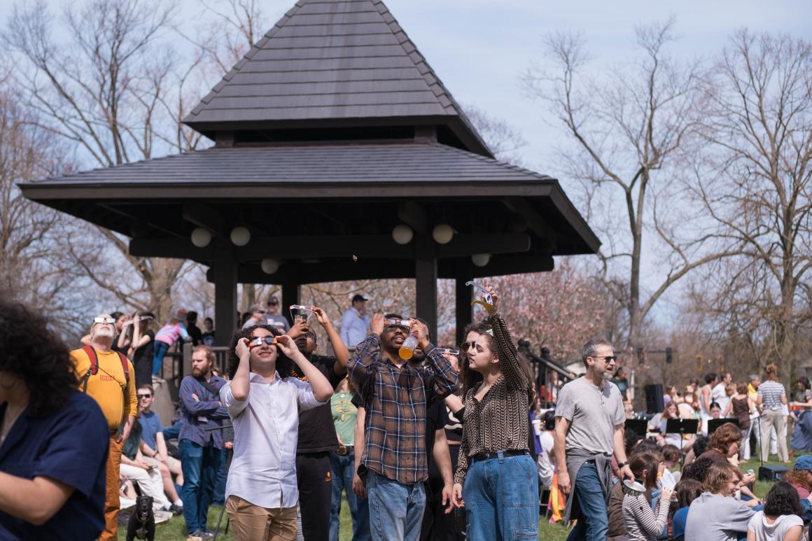 A group of Oberlin College students looking at the solar eclipse.