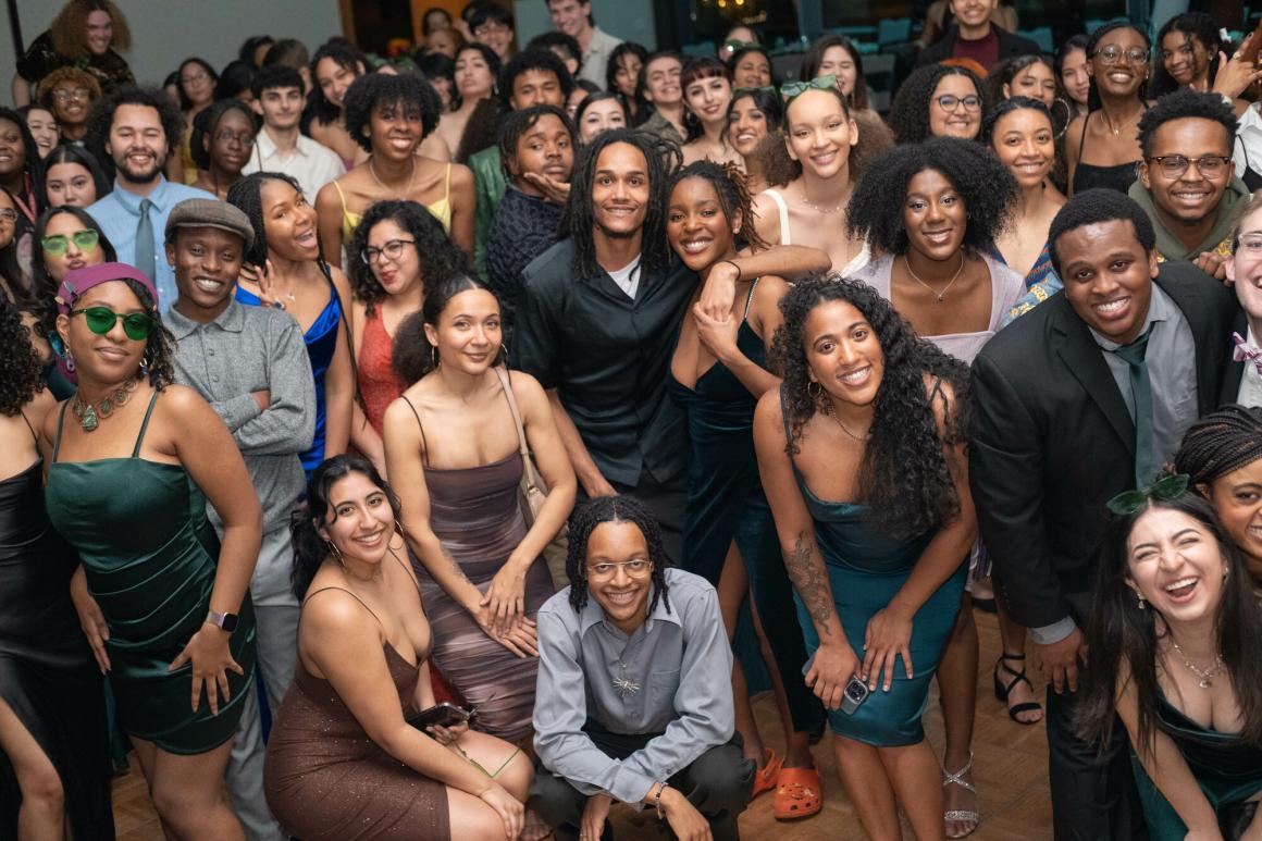 Students gathered for a large group photo at the ABUSUA Ball