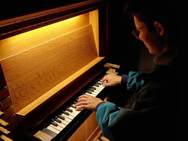 Walker plays an organ.