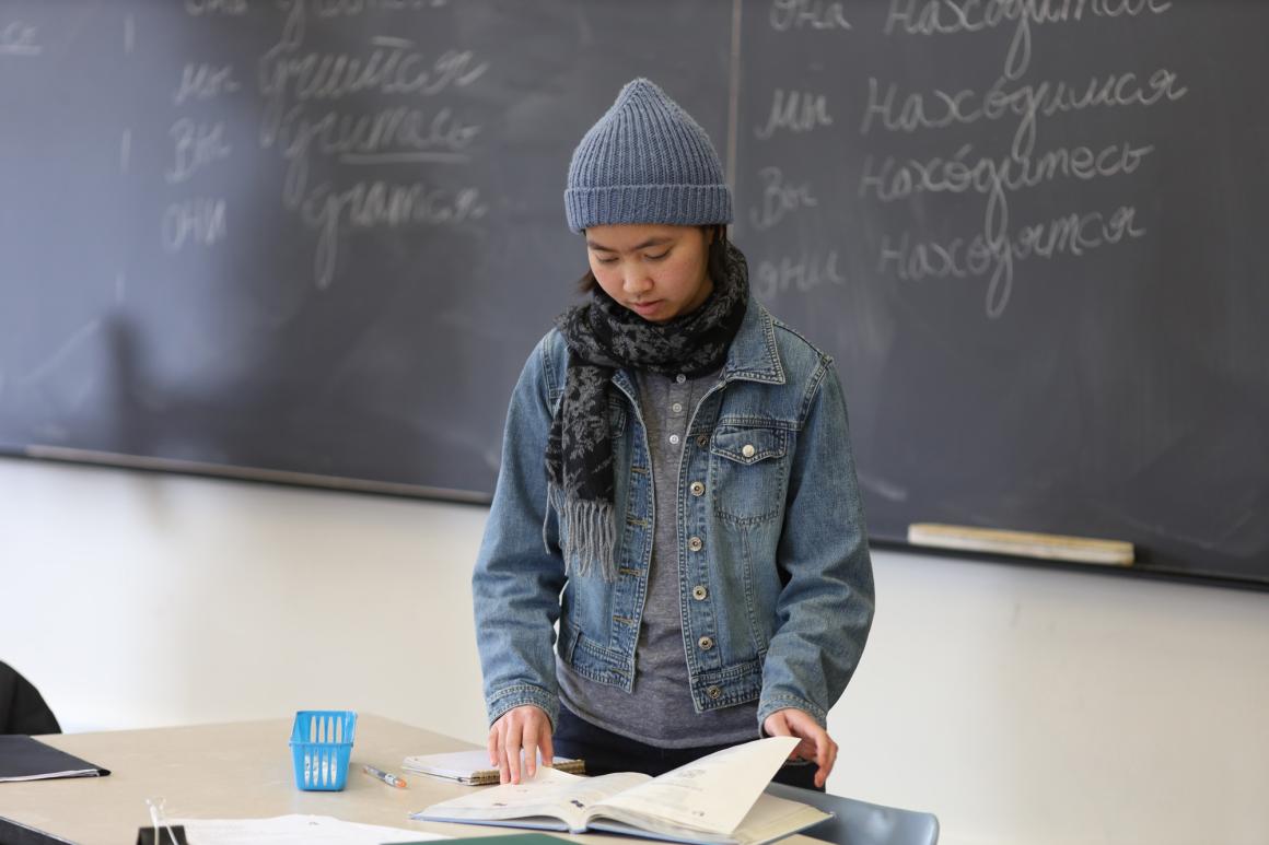 A student prepares to speak to the class.