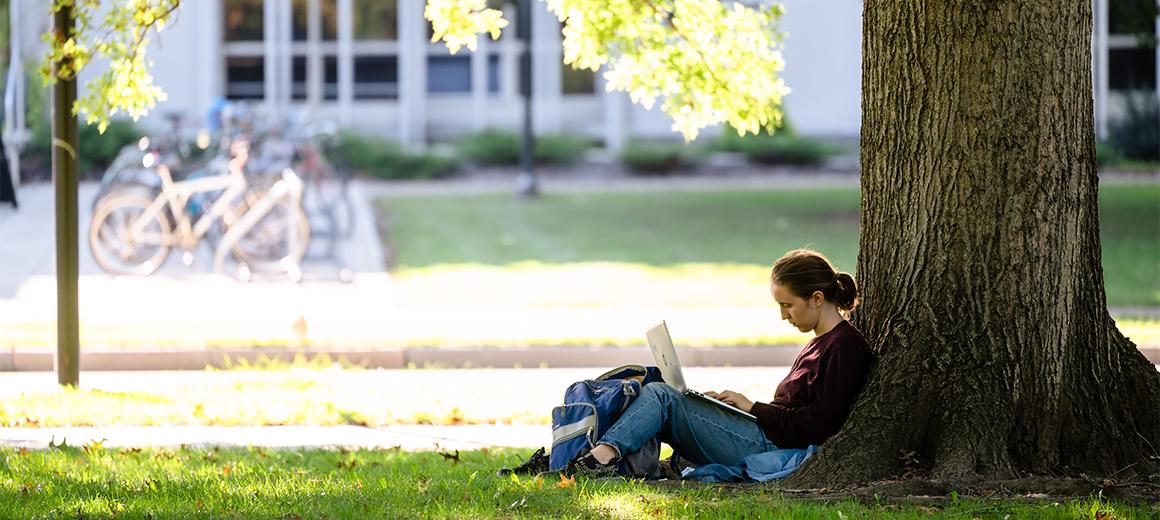 Student studying in Tappan Square