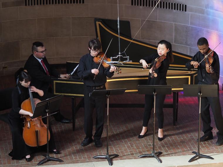 Students perform small ensemble works on harpsichord and Baroque violin and cello in Fairchild Chapel.