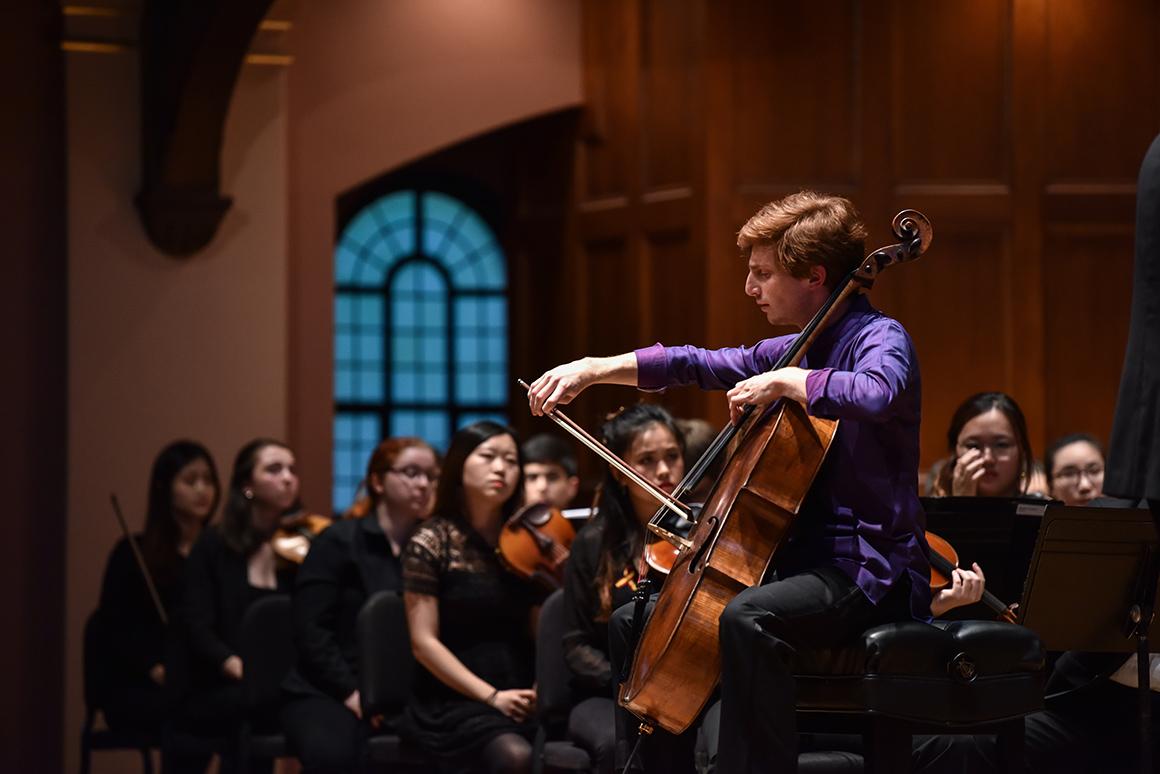 Cellist performs with orchestra