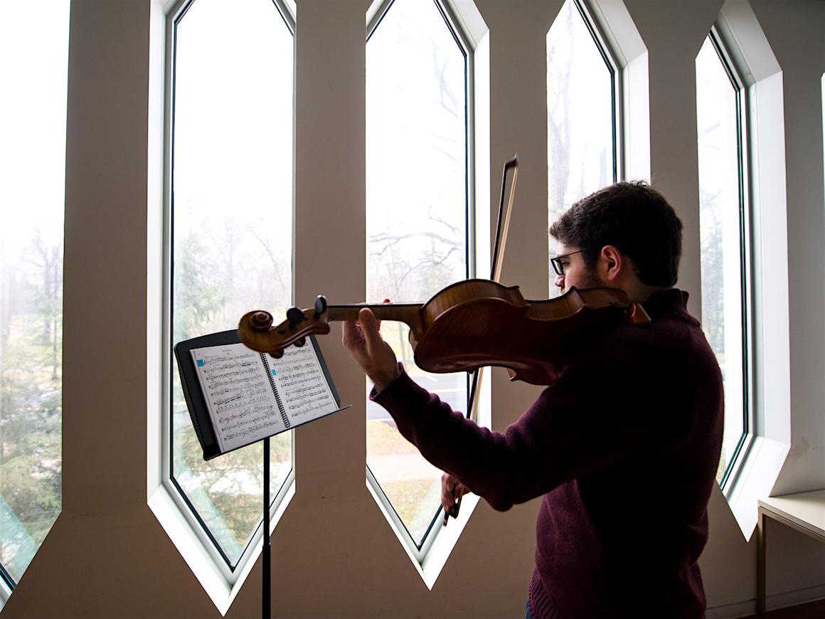 violist in practice room