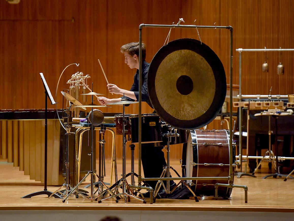 Percussion student performs with the Contemporary Music Ensemble in Warner Concert Hall.