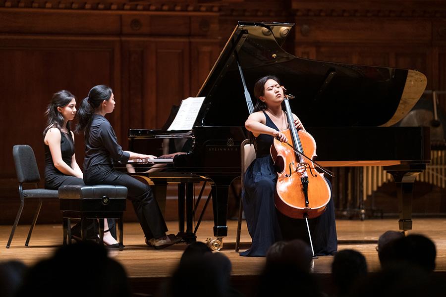 A pianist and cellist perform.