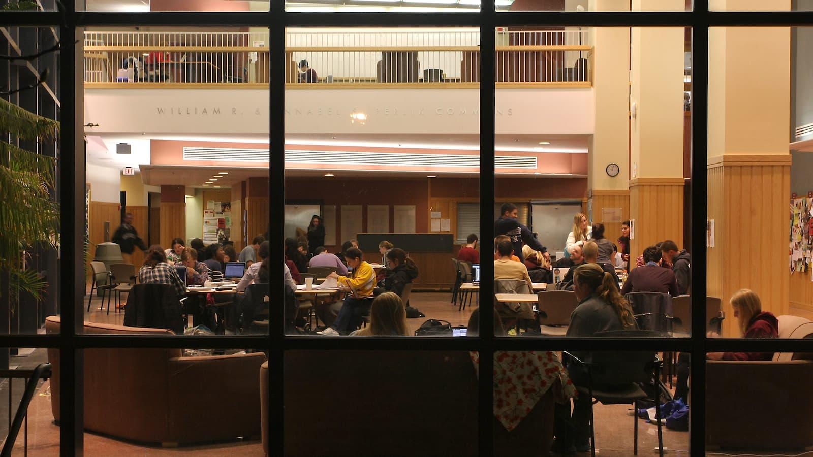 Students studying at night in Perlik Commons in the Science Center.