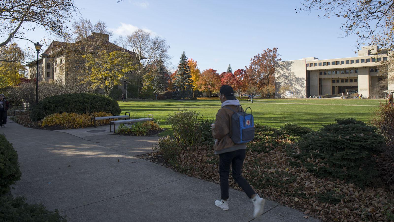 Students walking in Wilder Bowl on a sunny fall day.