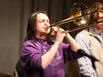 A student plays a trombone.