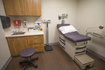 interior doctors room with medical supplies and furniture