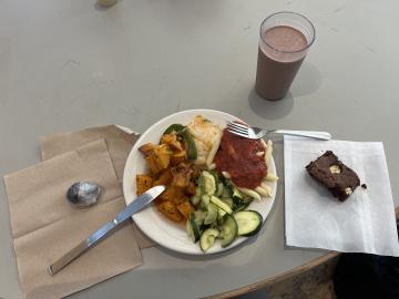 A meal from Stevenson Dining Hall with chocolate milk and a brownie on a table.