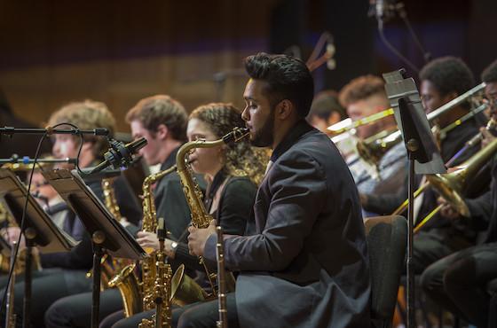 photo of student playing sax with jazz ensemble