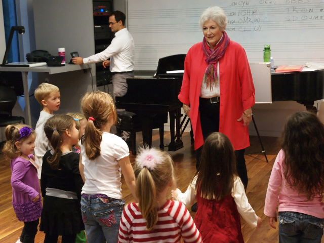 teacher standing in front of elementary students