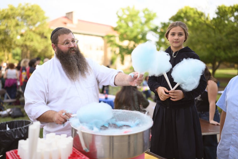 Rabbi Shlomo and his family offer cotton candy at the Connections Fair