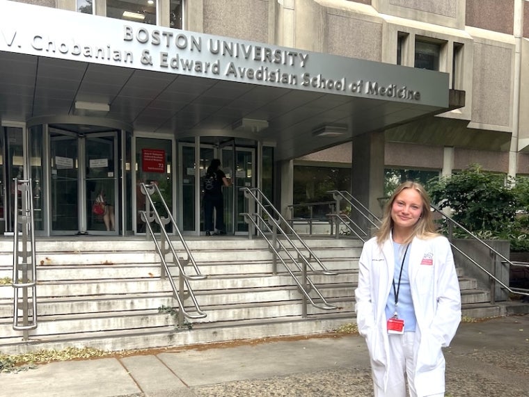 intern standing in front of hospital