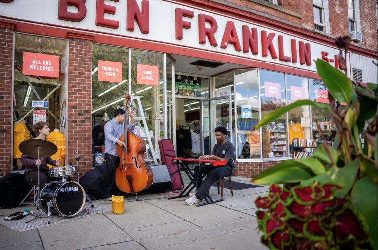 Students Playing in front of Ben Franklin