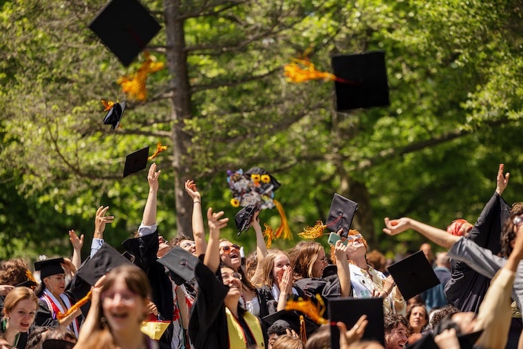 commencement caps in air