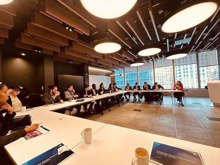 Group discussion taking place in a modern conference room.