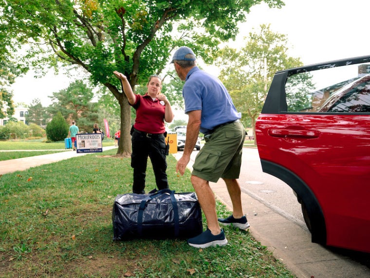 Safety officer directing a parent